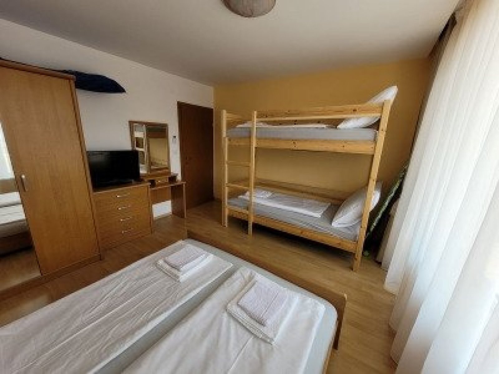 Three-room apartment with three glazed terraces and a private rose garden in Sveti Vlas, Bulgaria.