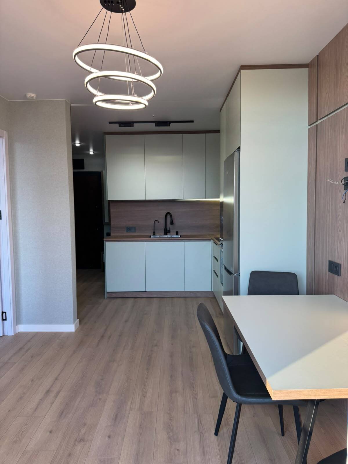 Recently renovated 2-bedroom apartment in Batumi, Georgia – high floor, view of the rugby stadium, and spacious balcony.