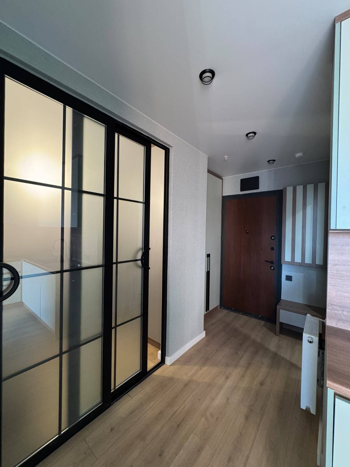 Recently renovated 2-bedroom apartment in Batumi, Georgia – high floor, view of the rugby stadium, and spacious balcony.
